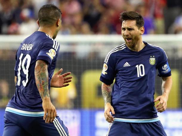 Messi celebrates with a teammate after scoring against the United States (Photo: Getty Images)