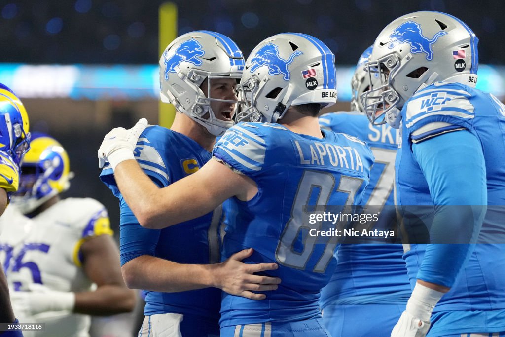 Sam LaPorta #87 of the Detroit Lions celebrates his touchdown with Jared Goff #16 during the second quarter against the Los Angeles Rams in the NFC Wild Card Playoffs at Ford Field on January 14, 2024 in Detroit, Michigan. (Photo by Nic Antaya/Getty Images)