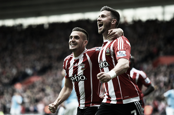 Long (R) celebrates scoring with teammate Dusan Tadic