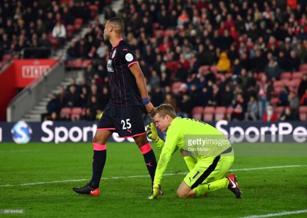 SOUTHAMPTON, ENGLAND - DECEMBER 23: Mathias Jorgensen of Huddersfield Town checks on Jonas Lossl of Huddersfield Town during the Premier League match between Southampton and Huddersfield Town at St Mary's Stadium on December 23, 2017 in Southampton, England. (Photo by Dan Mullan/Getty Images)