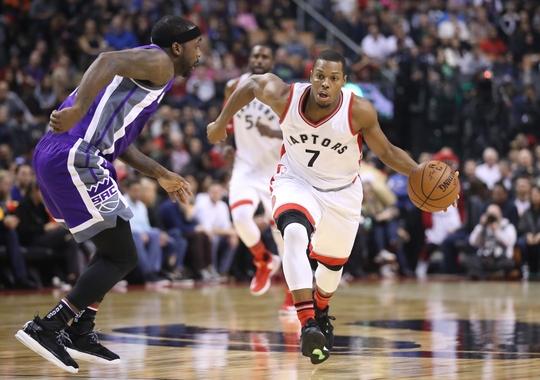 Kyle Lowry drives past Ty Lawson on the fast break