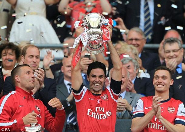 Mikel Arteta hoists the FA Cup aloft after Arsenal's victory against Hull City. | Image source: PA - Daily Mail