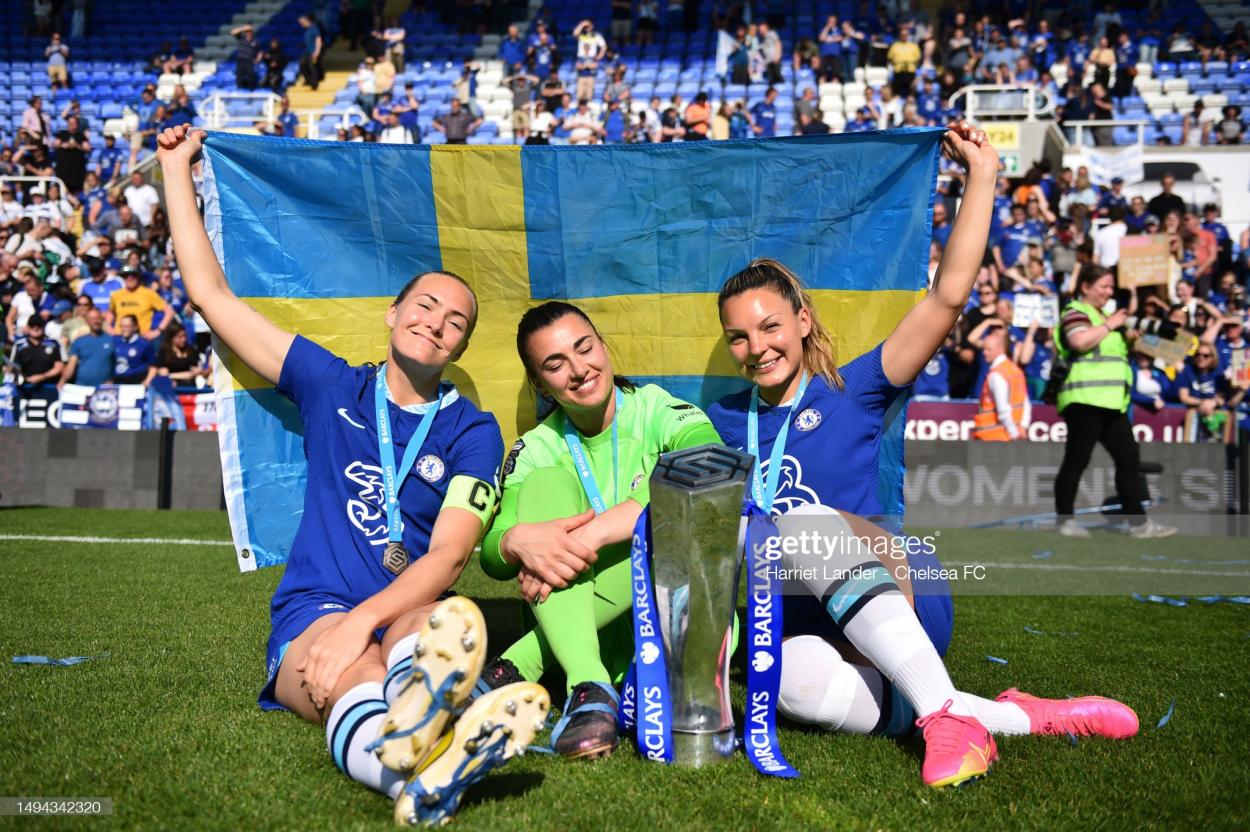 Magdalena Eriksson, Zecira Musovic, and Johanna Rytting Kaneryd of Chelsea celebrate with the Barclays Women's Super League trophy following their team's victory in the FA Women's Super League match between Reading and Chelsea at Madejski Stadium on May 27, 2023 in Reading, England. (Photo by Harriet Lander - Chelsea FC/Chelsea FC via Getty Images)