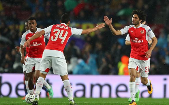 Elneny (far right) celebrates his super strike against Barcelona with midfield partner Coquelin. | Photo: Getty