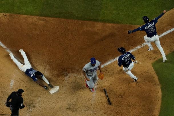 Arozarena slides in with the winning run in Game 4/Photo: David J. Phillip/Associated Press