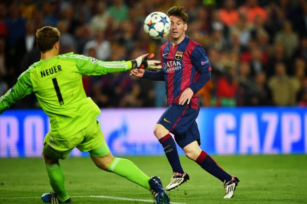 Messi dinks the ball over Manuel Neuer in the Champions League semi-final (photo: getty)