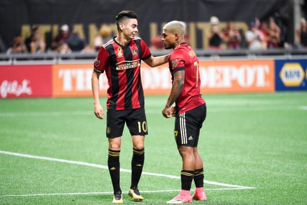 Miguel Almiron (left) and Josef Martinez (right) share a chat during a 3-0 win over FC Dallas. (Source: Adam Hagy/USA Today Sports)