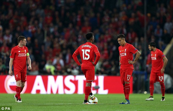 Milner (far left) and fellow players trudge back to position after Sevilla's equaliser (photo: PA)