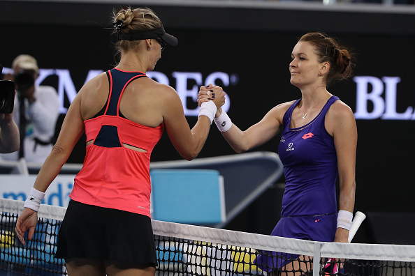 Lucic-Baroni and Radwanska shake hands at the net (Photo by Mark Kolbe / Getty Images)