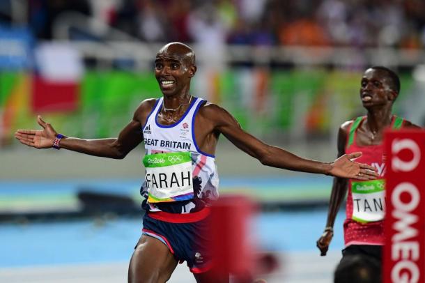 Mo Farah crosses the finish line just ahead of Paul Tanui to repeat as champion of the 10,000 meters/Photo: Getty Images