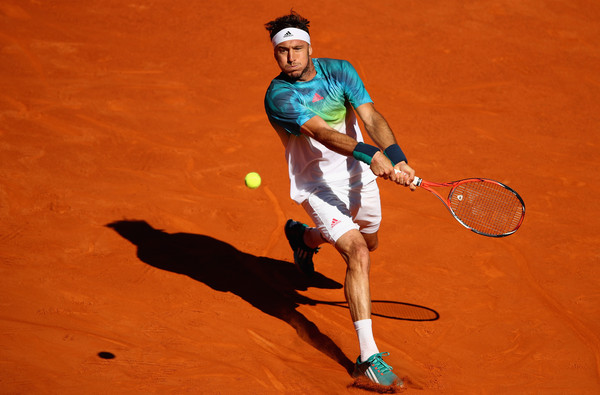 Juan Monaco of Argentina plays a backhand against Fernando Verdasco of Spain in their first round match during day two of the Mutua Madrid Open tennis tournament at the Caja Magica on May 01, 2016 in Madrid,Spain (Clive Brunskill/Getty)