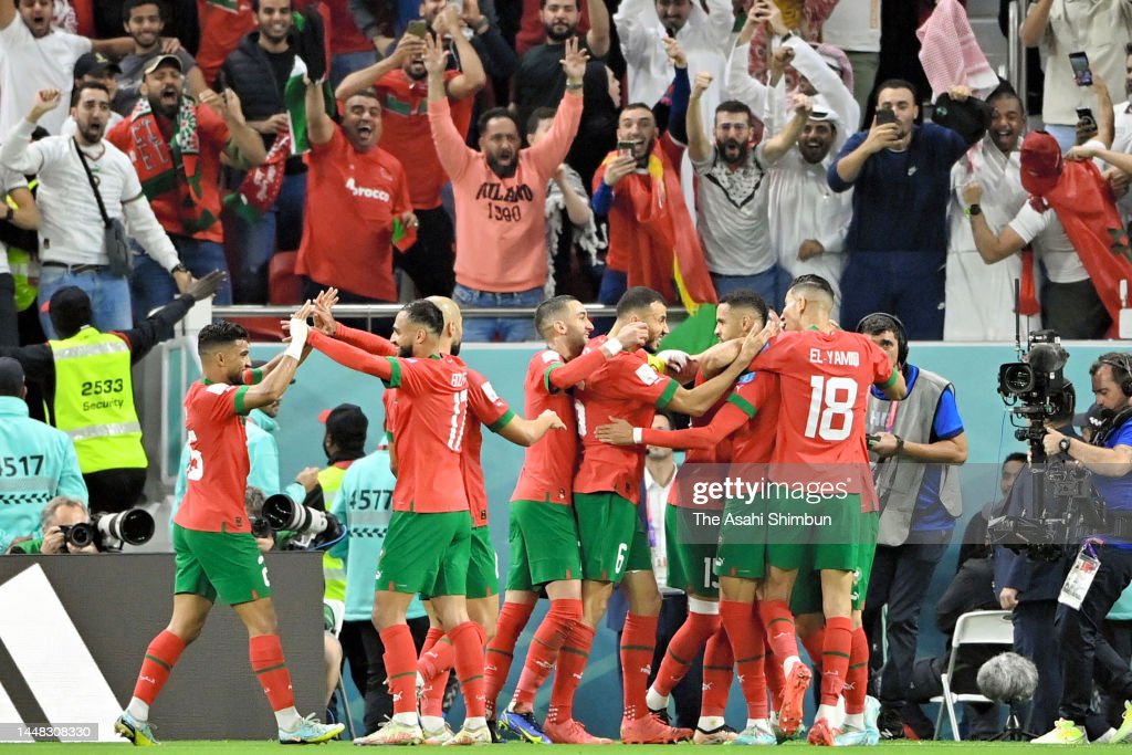 The players of Morocco celebrating after scoring their first goal at the World Cup. Photo by The Asahi Shimbun via Getty Images)