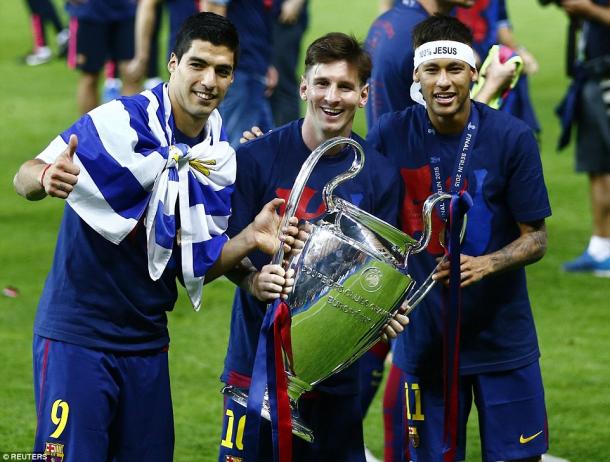 Messi, Suarez and Neymar, dubbed as MSN, hold the Champions League trophy (photo: reuters)