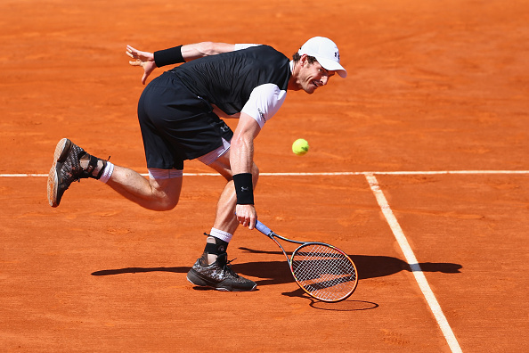 Andy Murray of Great Britain stretches to return during his semi-final match against Rafael Nadal of Spain during the semi final match on day seven of the Monte Carlo Rolex Masters at Monte-Carlo Sporting Club on April 16, 2016 in Monte-Carlo, Monaco