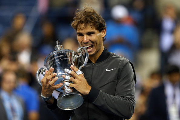 Nadal grasping his second US Open trophy in 2013 (Photo by Elsa / Getty Images)