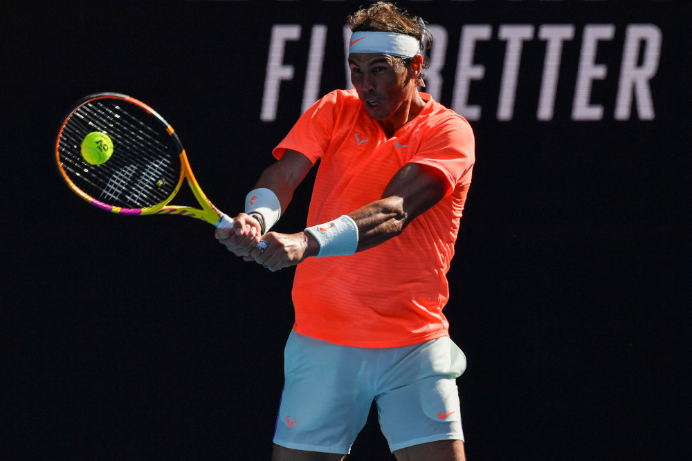 Nadal plays a backhand in his fourth-round victory/Photo: Paul Crook/AFP