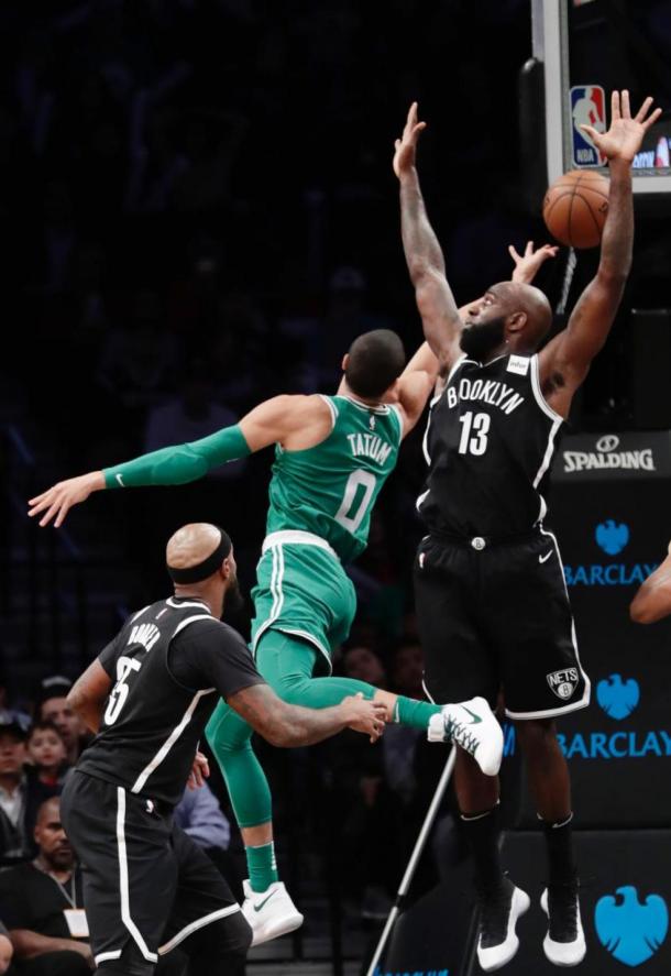 Boston Celtics' Jayson Tatum (0) goes for a layup against Brooklyn Nets' Quincy Acy (13). Photo: AP Photo/Frank Franklin II  