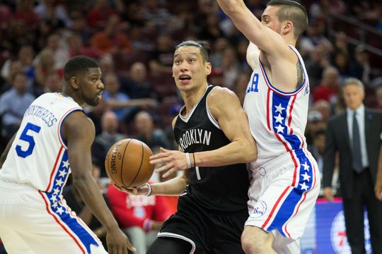 Brooklyn Nets guard Jeremy Lin (7) drives past Philadelphia 76ers guard T.J. McConnell (1). Photo by: Bill Streicher-USA TODAY Sports