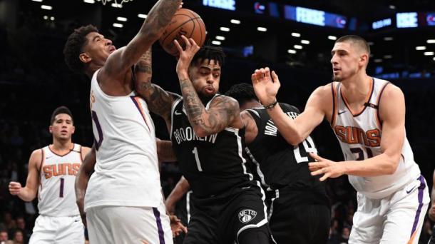 Nets guard D'Angelo Russell (1) grabs a rebound. Photo:Kathleen Malone-Van Dyke  