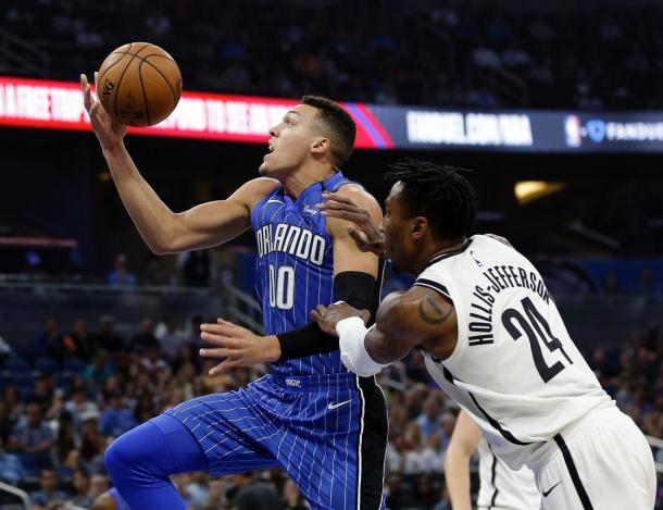 Gordon drives in for two of his career-high 41 points/Photo: John Raoux/Getty Images