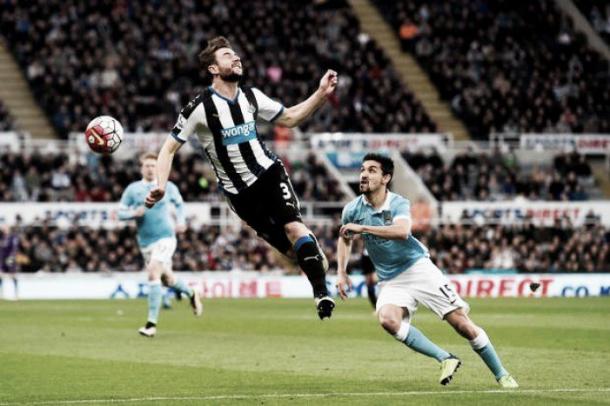 Paul Dummett heads clear of Jesus Navas | Photo: Belfast Telegraph