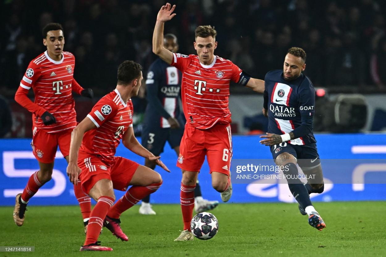 Neymar surrounded by red shirts during PSG v Bayern Munich. (Photo by Anne-Christine Poujoulat/AFP/Getty Images)