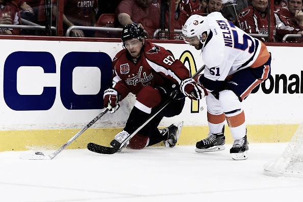APRIL 23: Evgeny Kuznetsov #92 of the Washington Capitals and Frans Nielsen #51 of the New York Islanders go after the puck in the first period during Game Five of the Eastern Conference Quarterfinals during the 2015 NHL Stanley Cup Playoffs at Verizon Center on April 23, 2015 in Washington, DC. (Photo by Rob Carr/Getty Images)