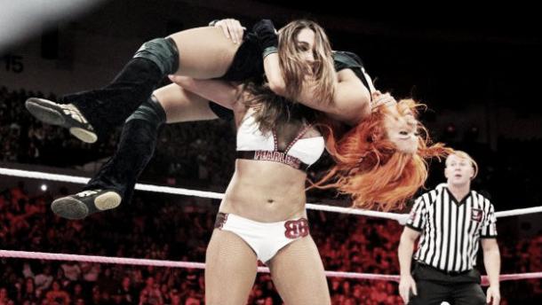 Nikki Bella punishing Becky Lynch (image: dailywrestlingnews.com)