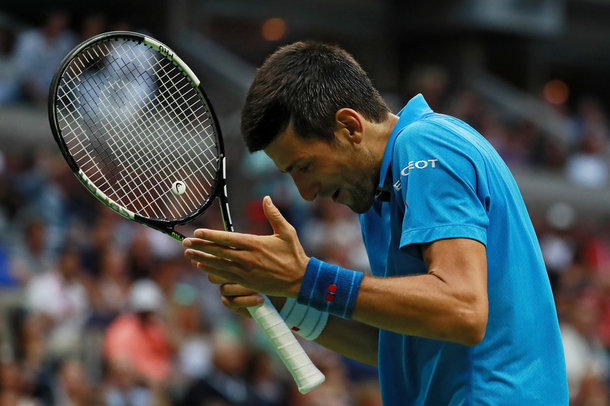 Djokovic reacts to a point (Photo by Michael Reaves/Getty Images)