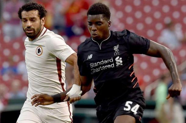 Ojo in action against Roma's Mohamed Salah, who also got on the scoresheet. (Picture: Liverpool Echo)