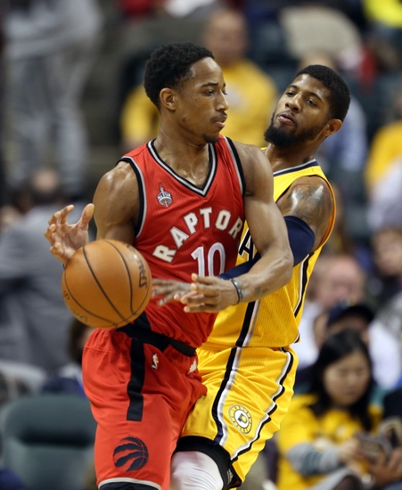 Raptors guard Demar DeRozan (10) is guarded by Pacers forward Paul George (13) Credit:Brian Spurlock- USA TODAY Sports