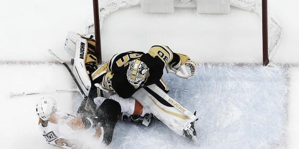 Jakub Vorcek tries to force one in against the Pen's Matt Murray. (Photo credit: USA Today)