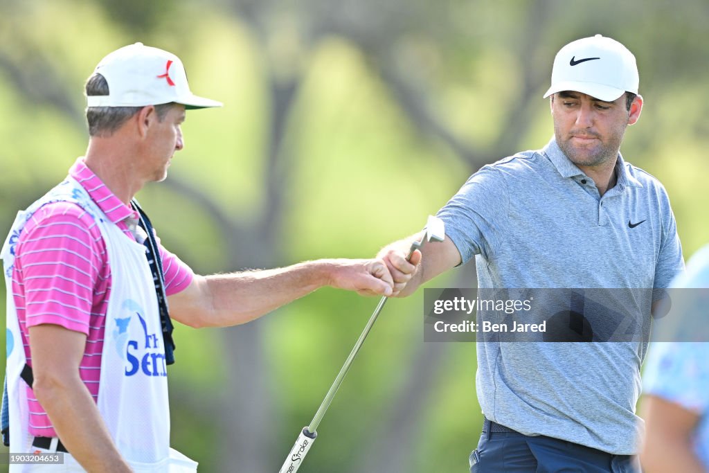 Scottie Scheffler gives knuckles with caddie Ted Scott on the 18th green during the second round of The Sentry at The Plantation Course at Kapalua on January 5, 2024 in Kapalua, Maui, Hawaii. (Photo by Ben Jared/PGA TOUR via Getty Images)