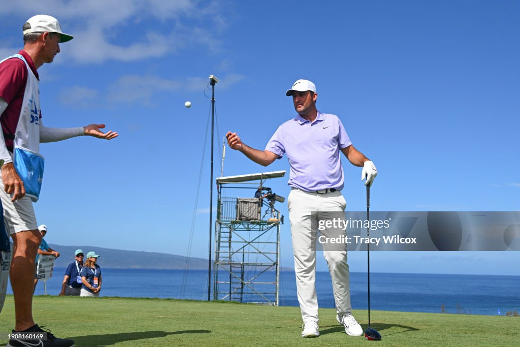 Scottie Scheffler asks for another ball from caddie, Ted Scott, on the 13th tee during the final round of The Sentry at The Plantation Course at Kapalua on January 7, 2024 in Kapalua, Maui, Hawaii. (Photo by Tracy Wilcox/PGA TOUR via Getty Images)