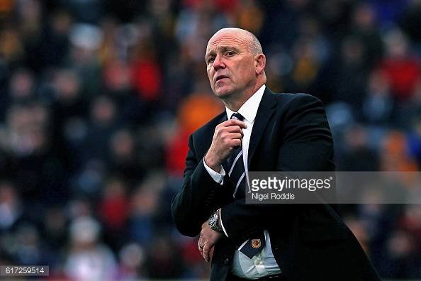 Phelan walking Hull's touchline. | Photo: Getty Images