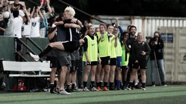 Megan Rapinoe of the Seattle Reign celebrates a goal against the Utah Royals on July 11, 2018 | Photo: NWSLsoccer.com