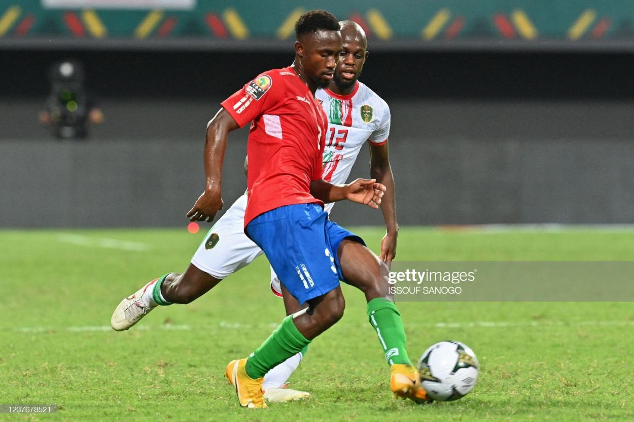 Gambia's midfielder Ablie Jallow (front) is challenged by Mauritania's midfielder Almike Moussa N'Diaye during the Group F Africa Cup of Nations (CAN) 2021 football match between Mauritania and Gambia at Limbe Omnisport Stadium in Limbe on January 12, 2022. (Photo by Issouf SANOGO / AFP) (Photo by ISSOUF SANOGO/AFP via Getty Images)