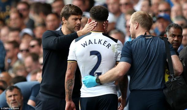 Pochettino consoles Walker as he comes off with illness (photo: EMPICS Sport)