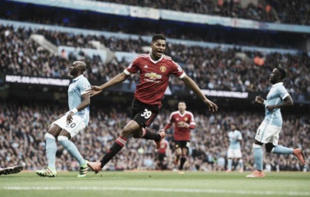 Marcus Rashford celebrates after becoming the youngest player in Premier League history to score in a Manchester derby. | Photo: Getty Images