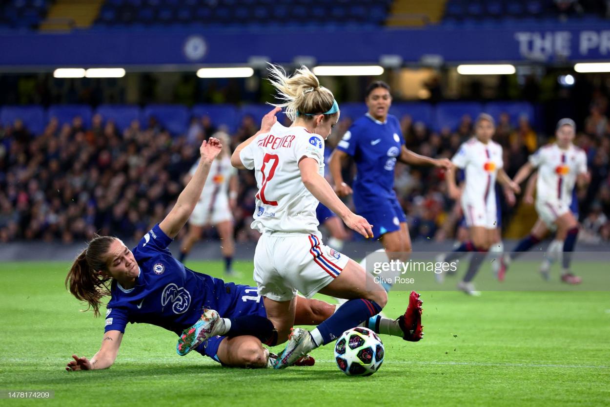Guro Reiten of Chelsea tackles Ellie Carpenter of Olympique Lyonnais during the UEFA Women's Champions League quarter-final 2nd leg match between Chelsea FC and Olympique Lyonnais at Stamford Bridge on March 30, 2023 in London, England. (Photo by Clive Rose/Getty Images)