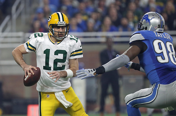 Green Bay Packers quarterback Aaron Rodgers tries to avoid being sacked against the Detroit Lions (Photo by Leon Halip/Getty Images)