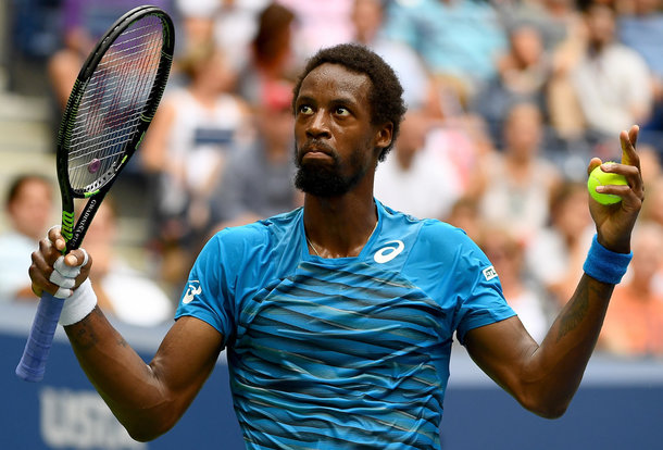 Monfils reacts to the crowd booing (Photo by Alex Goodlett/Getty Images)