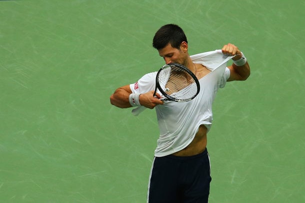 Djokovic rips his shirt in frustration (Photo by Mike Stobe/Getty Images)