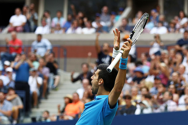 Djokovic celebrates a point in the tiebreak (Photo by Elsa/Getty Images)