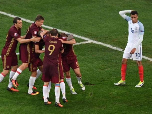 The Russia players celebrate their late equaliser against England | Photo: Getty images