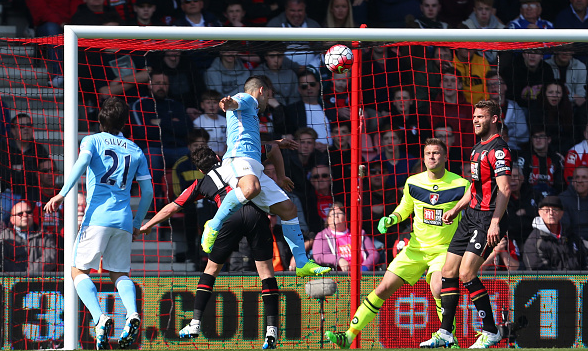 Aguero leaps above his marker to head home, giving City a three-goal cushion in style. | Photo: Getty