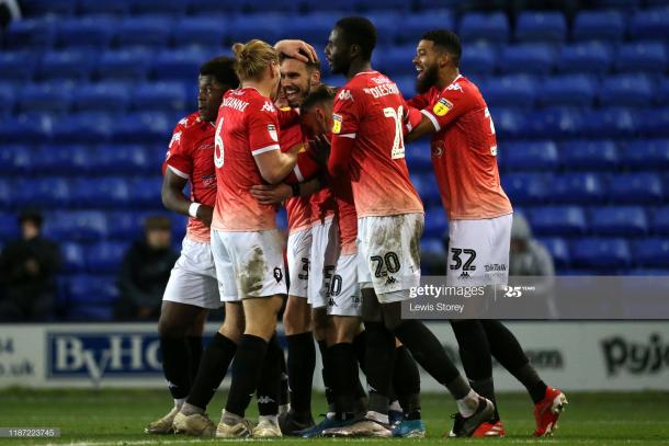 BIRKENHEAD, ENGLAND - NOVEMBER 12: Liam Hogan of Salford City celebrates scoring his sides second goal during the Leasing.com Trophy Northern Group C match between Tranmere Rovers and Salford City at Prenton Park on November 12, 2019 in Birkenhead, England. (Photo by Lewis Storey/Getty Images)