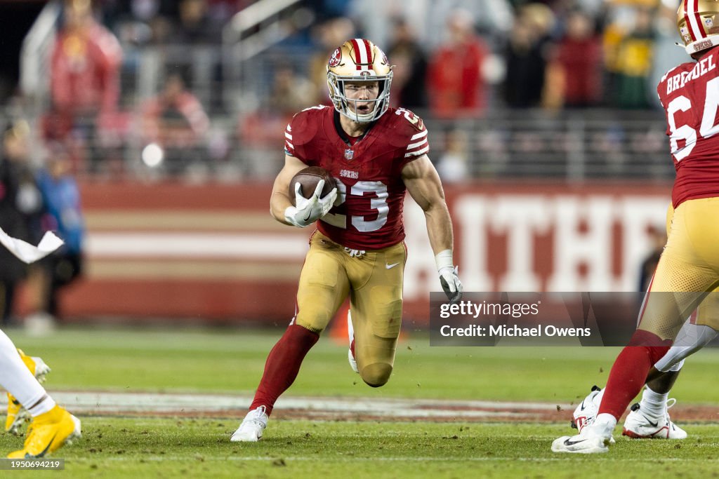Christian McCaffrey #23 of the San Francisco 49ers runs with the ball and scores a touchdown during an NFL divisional round playoff football game between the San Francisco 49ers and the Green Bay Packers at Levi's Stadium on January 20, 2024 in Santa Clara, California. (Photo by Michael Owens/Getty Images)