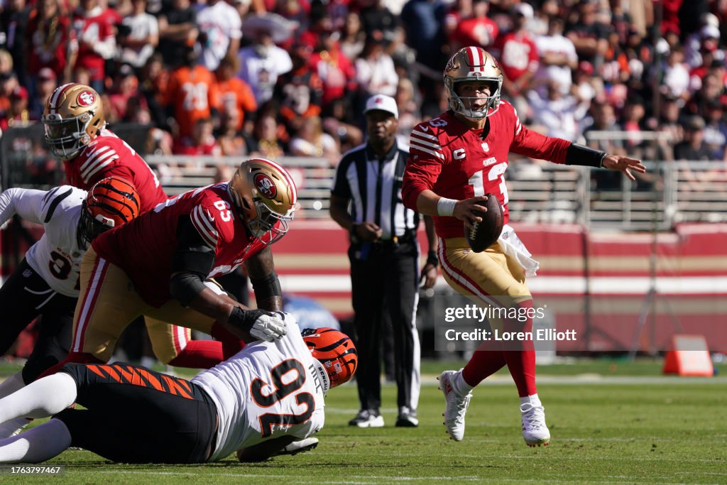Brock Purdy #13 of the San Francisco 49ers scrambles with the ball during the first half against the Cincinnati Bengals at Levi's Stadium on October 29, 2023 in Santa Clara, California. (Photo by Loren Elliott/Getty Images)