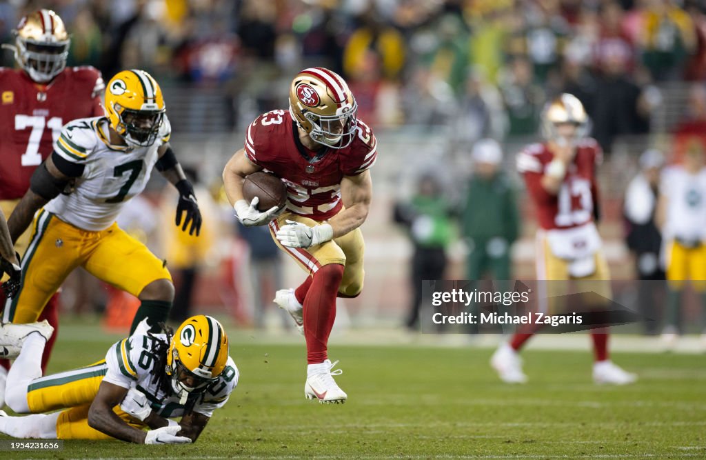 Christian McCaffrey #23 of the San Francisco 49ers rushes for a 39-yard touchdown during the NFC Divisional Playoff game against the Green Bay Packers at Levi's Stadium on January 20, 2024 in Santa Clara, California. (Photo by Michael Zagaris/San Francisco 49ers/Getty Images)
